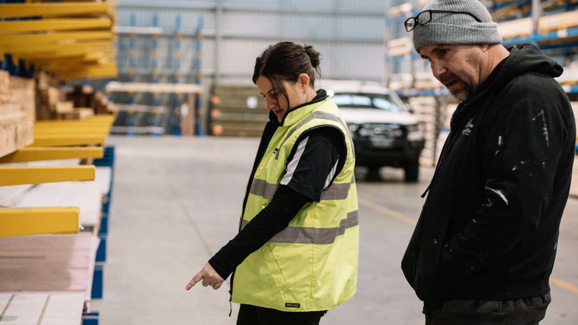 Reliability - Jack Bowen article featuring Bowens employee helping customer choose timber