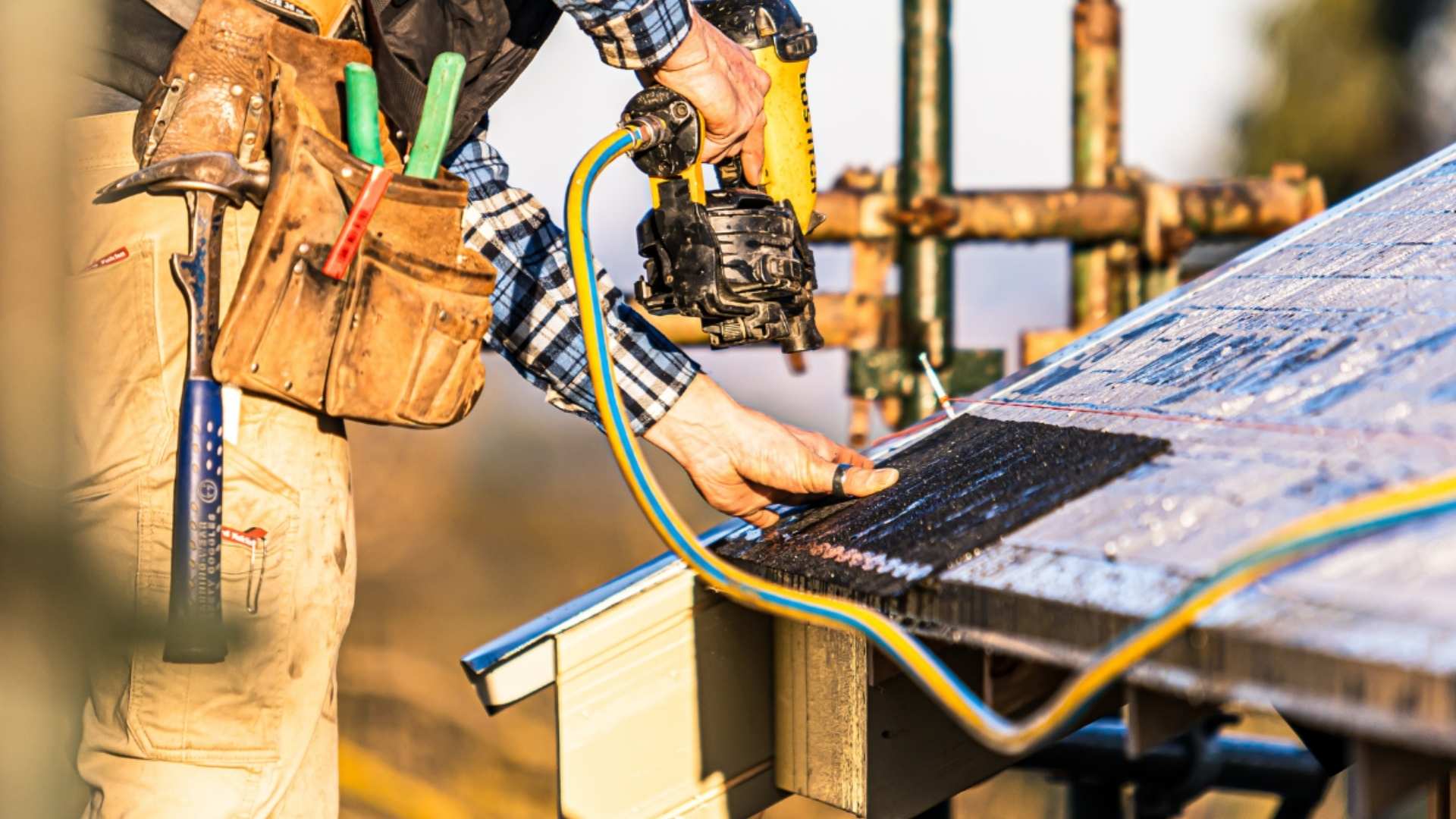 Trade installing gaf roofing with nail gun. 