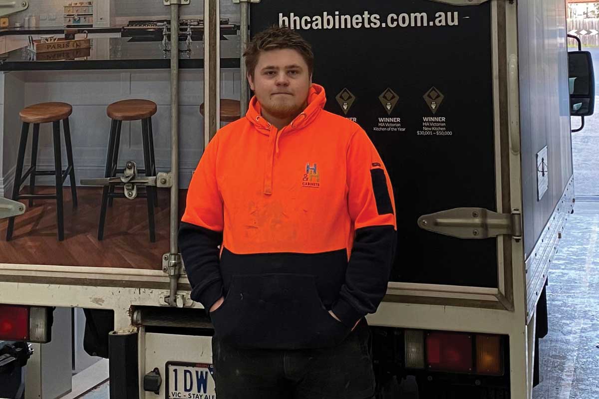 a builder wearing an orange satefy workwear, Reed McLean, Victorian Apprentice of the Year 2022