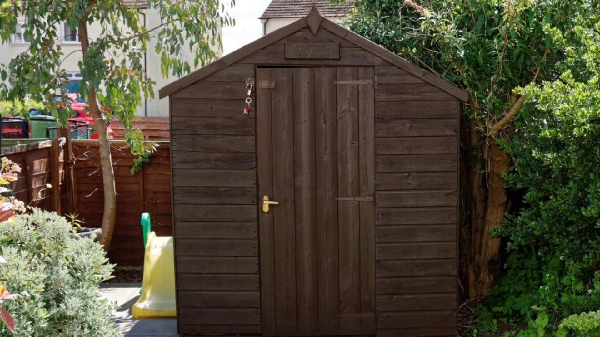 Cubby house style shed in garden.