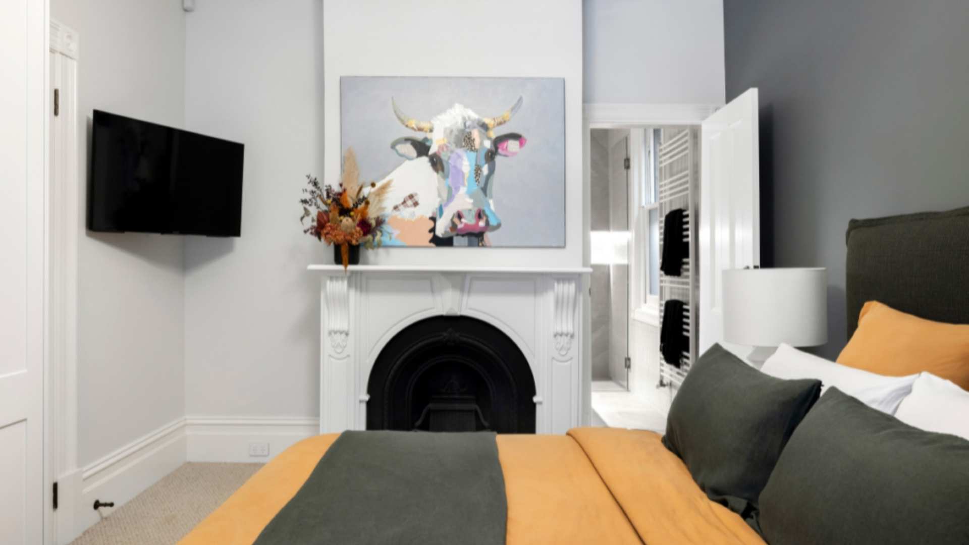 Bedroom fully furnished with TV and Bed.