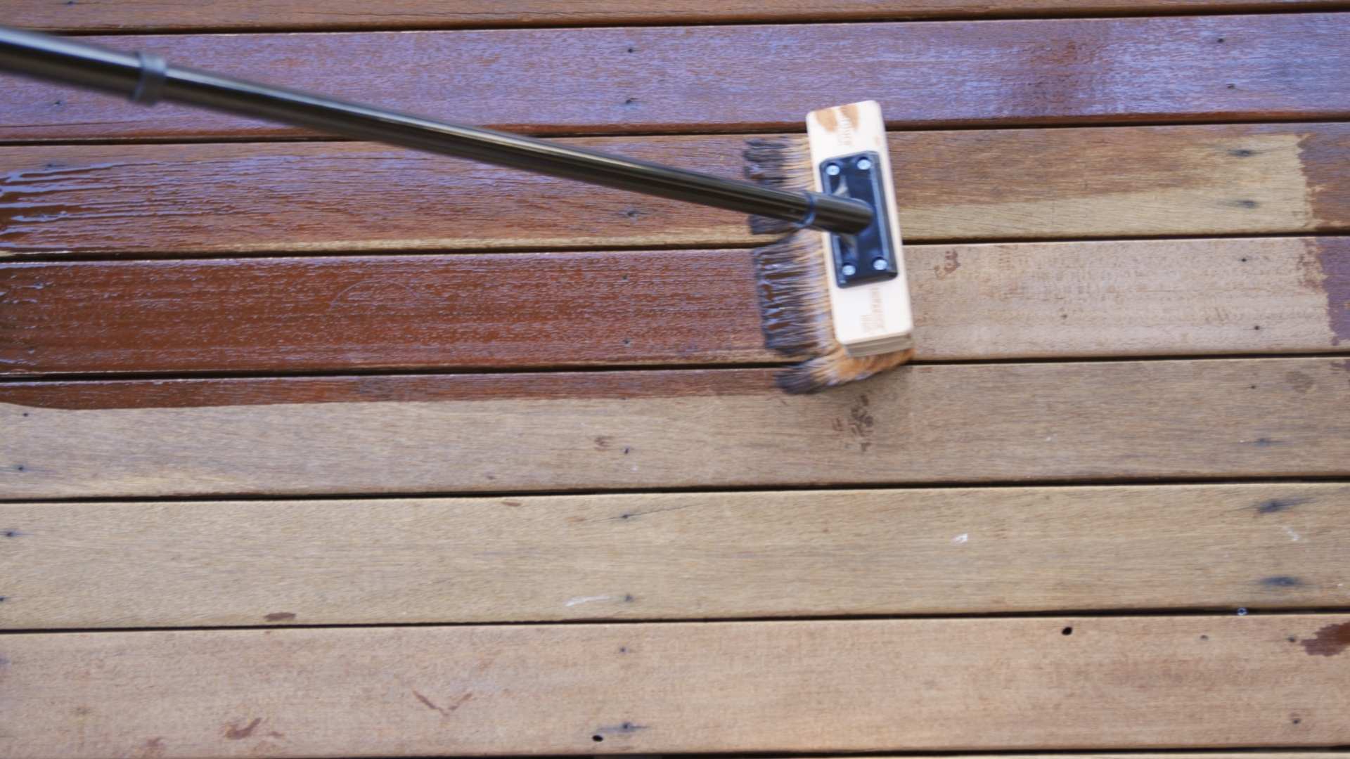 Decking in the process of being oiled.