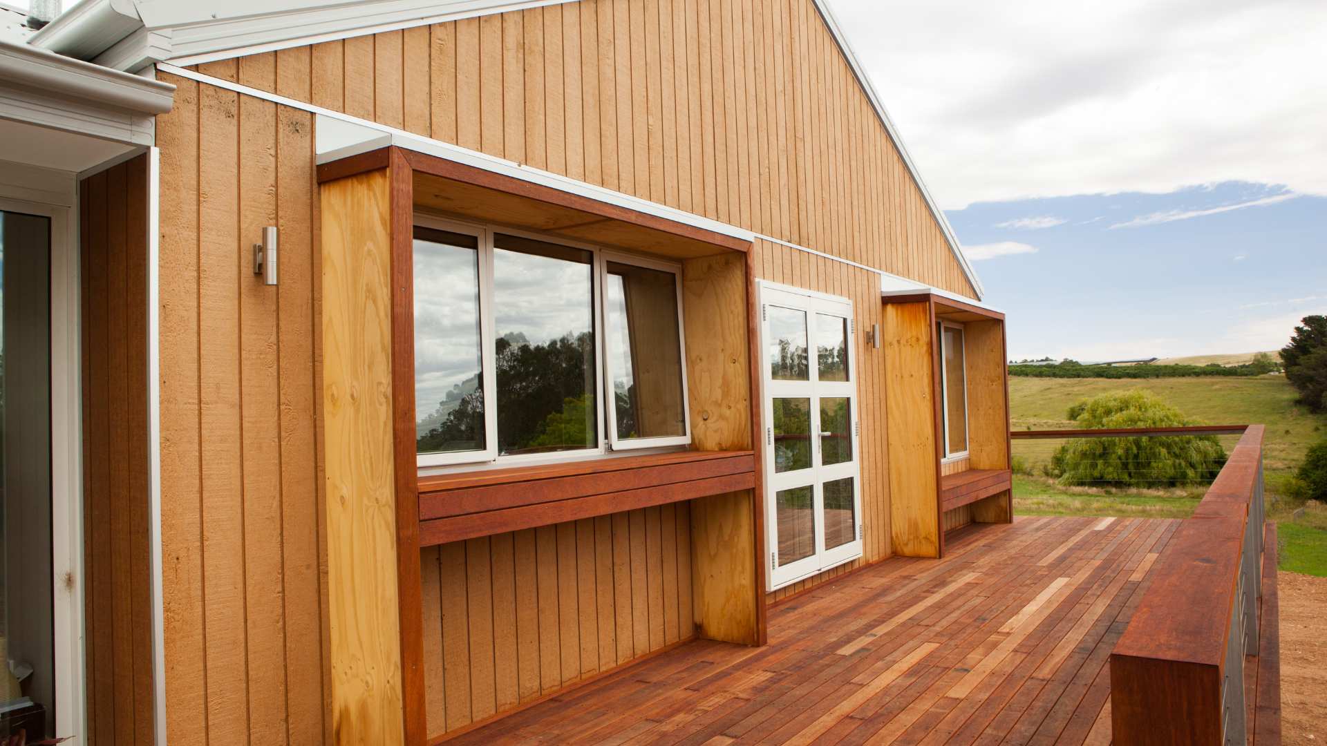 A close-up of a house featuring weathergroove 150 natural cladding.