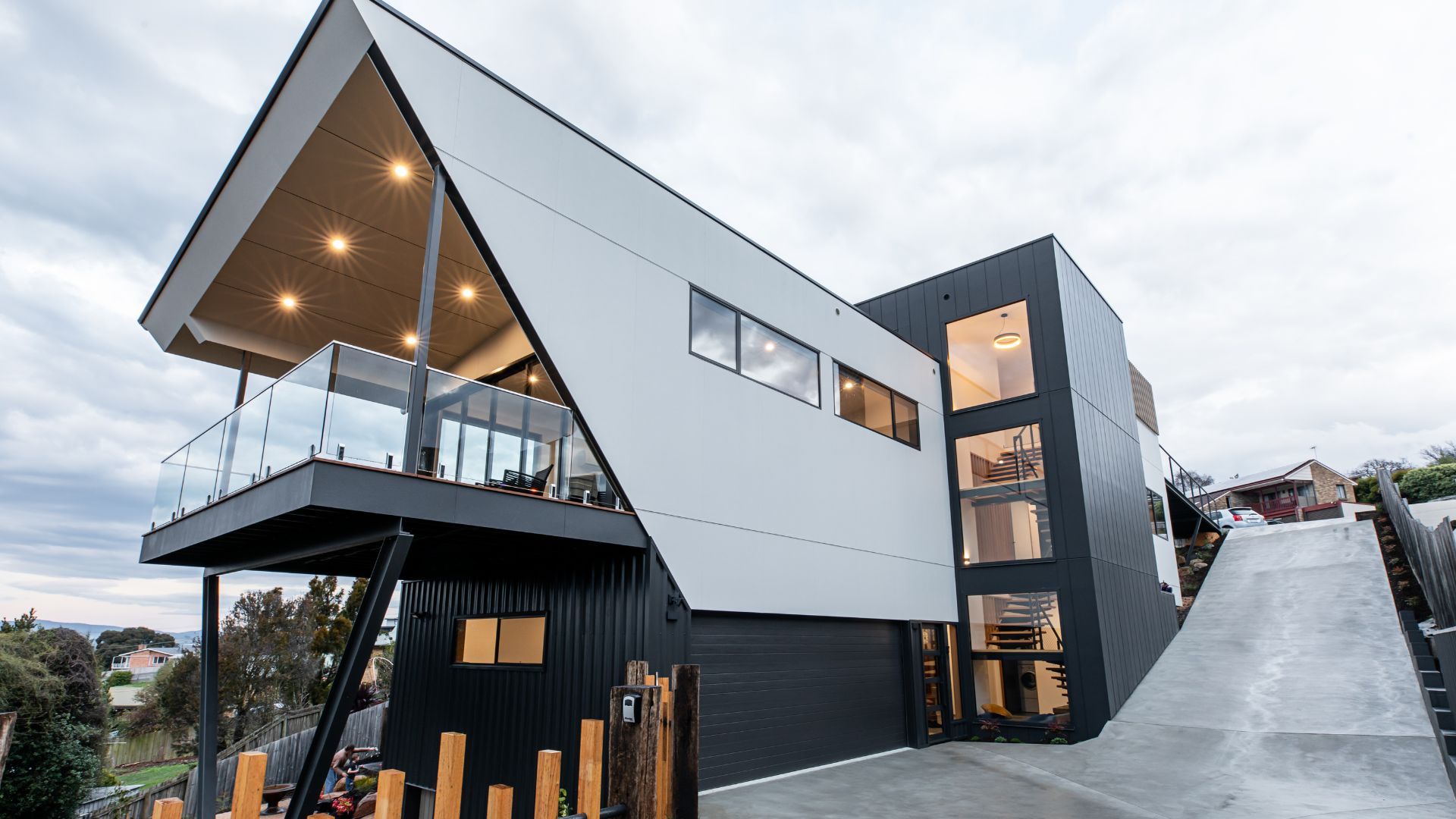Modern house with slide, showcasing 7-Star energy efficiency rating. Energy-efficient design, insulation, and high-performance glazing.