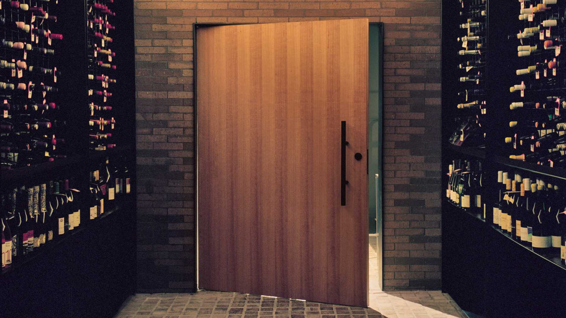 Enhance your home's security and aesthetic appeal with a modern entrance featuring wooden slats. Learn more about choosing the right external door here.