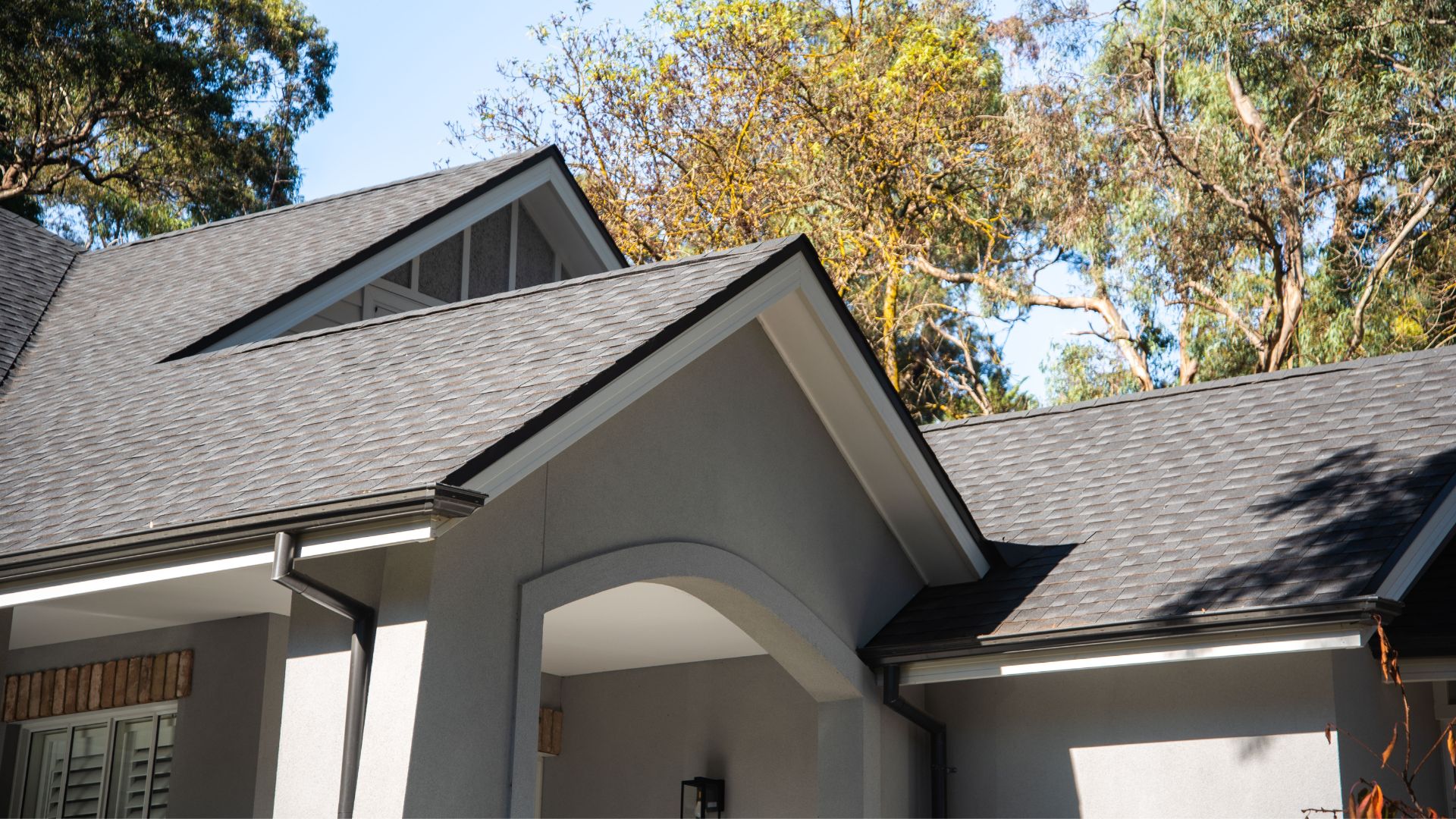 A house with a GAF Roofing and black trim.