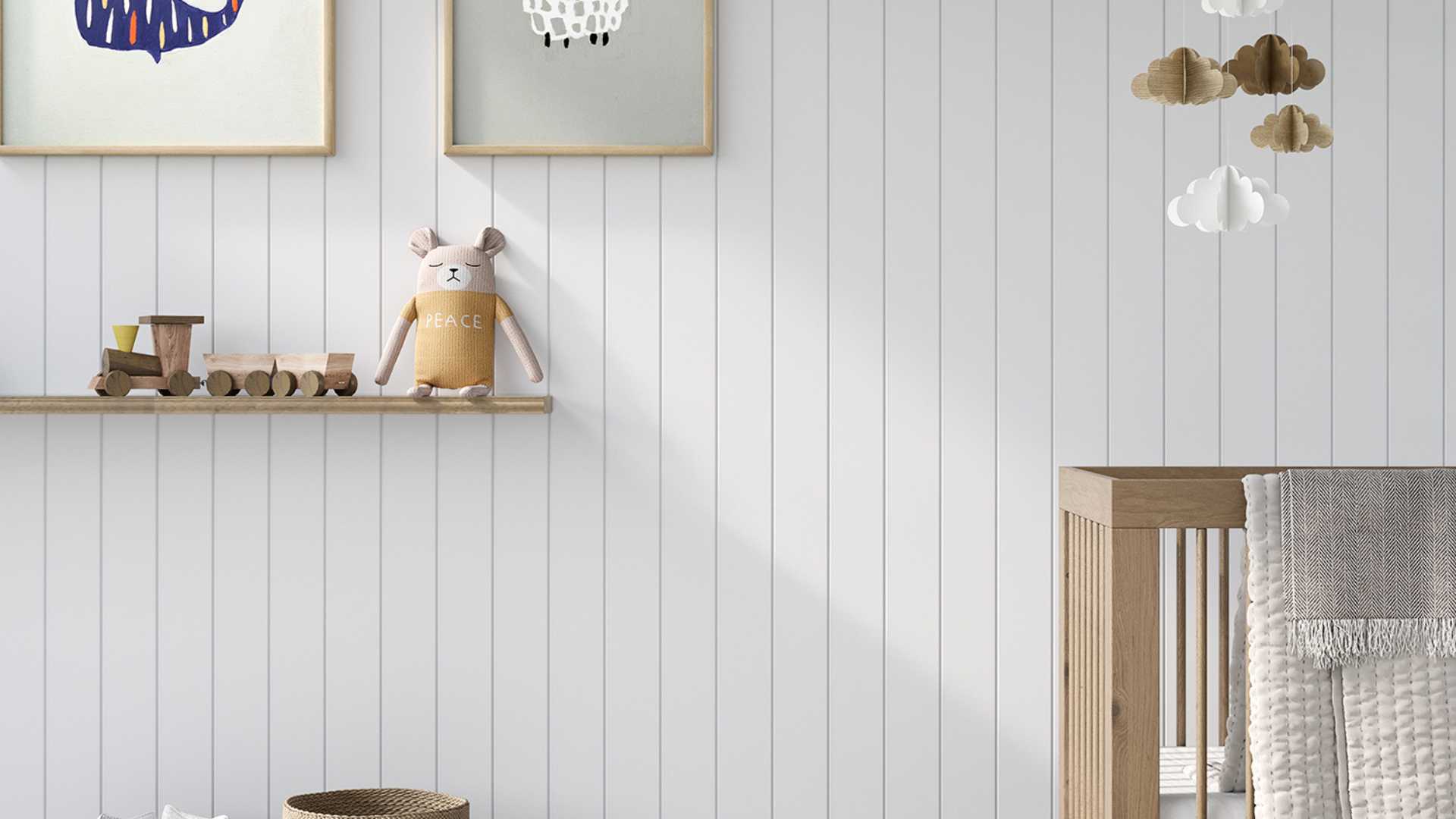 Baby's room featuring wooden furniture, shelf, and Laminex interior wall lining.