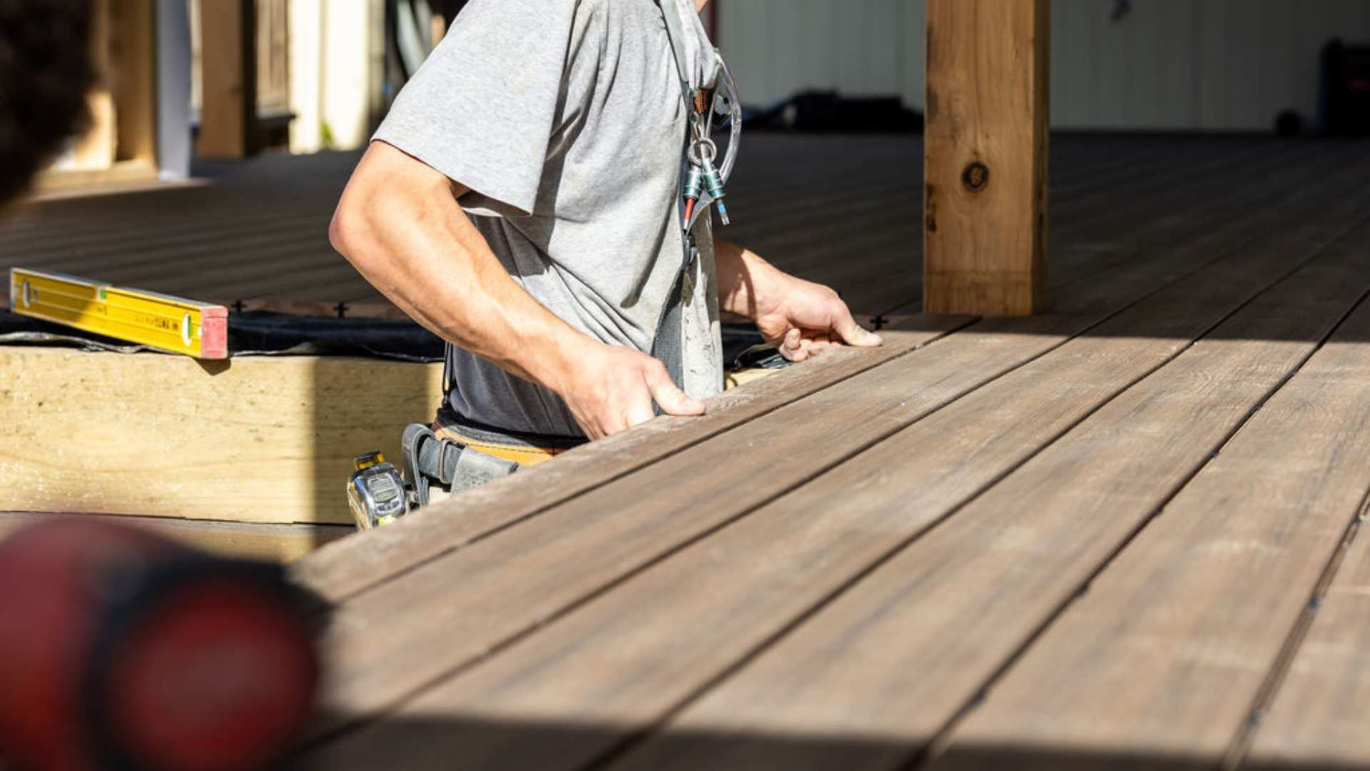Installation of composite decking at job site.