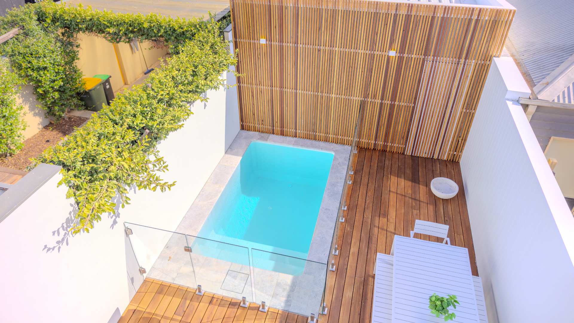 Birds eye view of blackbutt timber decking in a backyard setting.