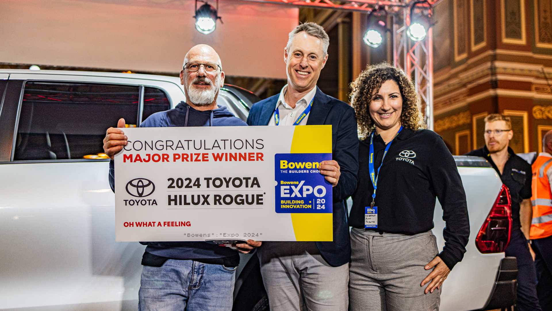 The winner of the Toyota Hilux Rogue giveaway with John Bowen and Toyota spokesperson.