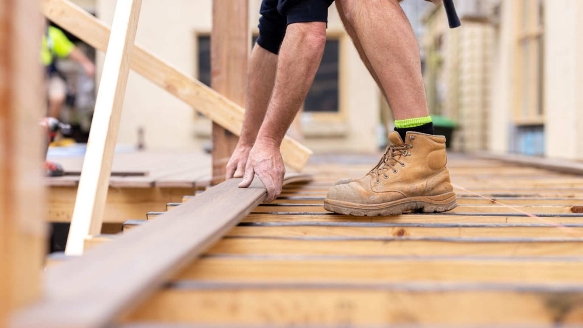 Installation of composite decking on residential jobsite.