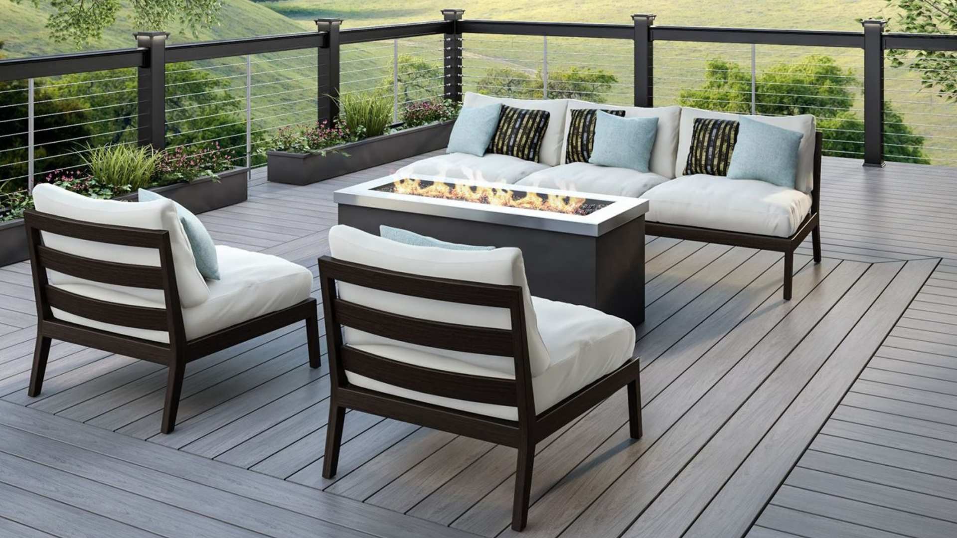 Deckorators decking used in project overlooking greenery with table and chairs.