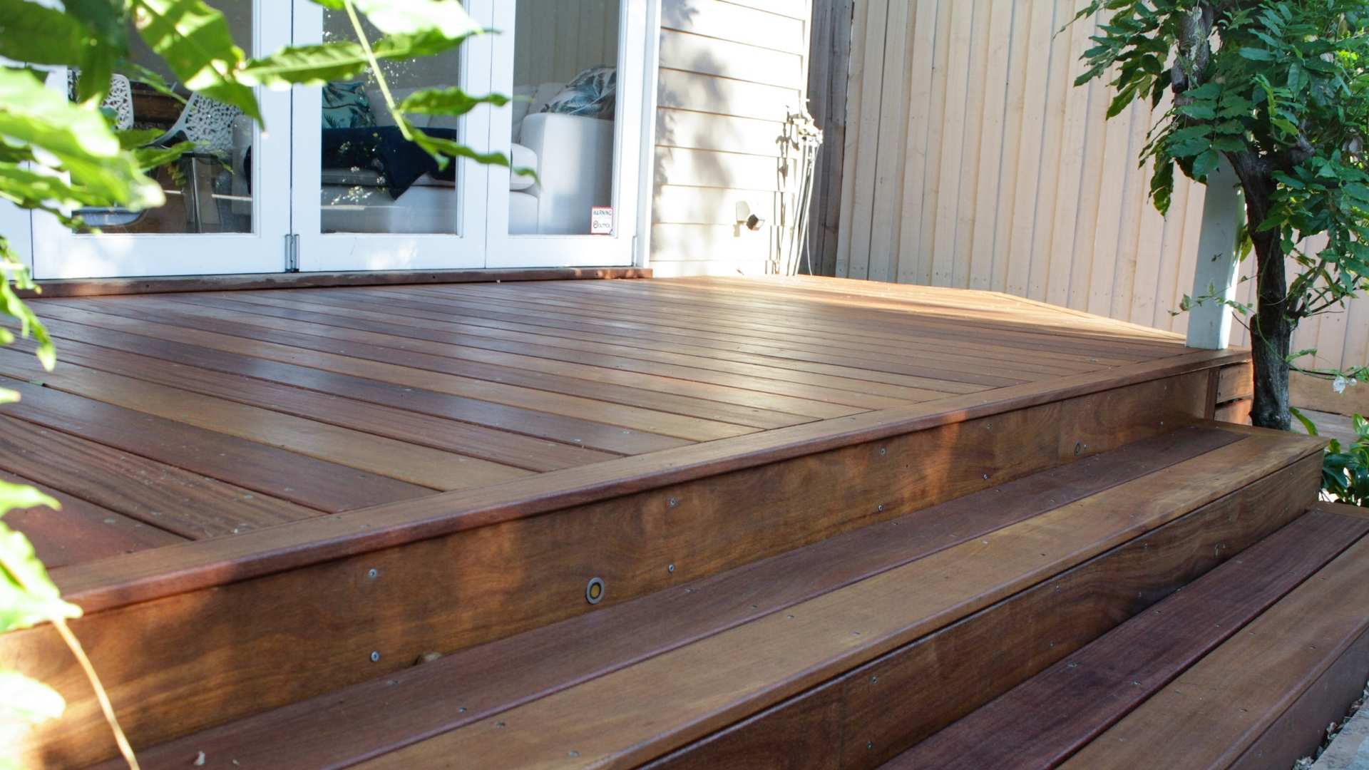 Timber decking used in small spaces with two steps.