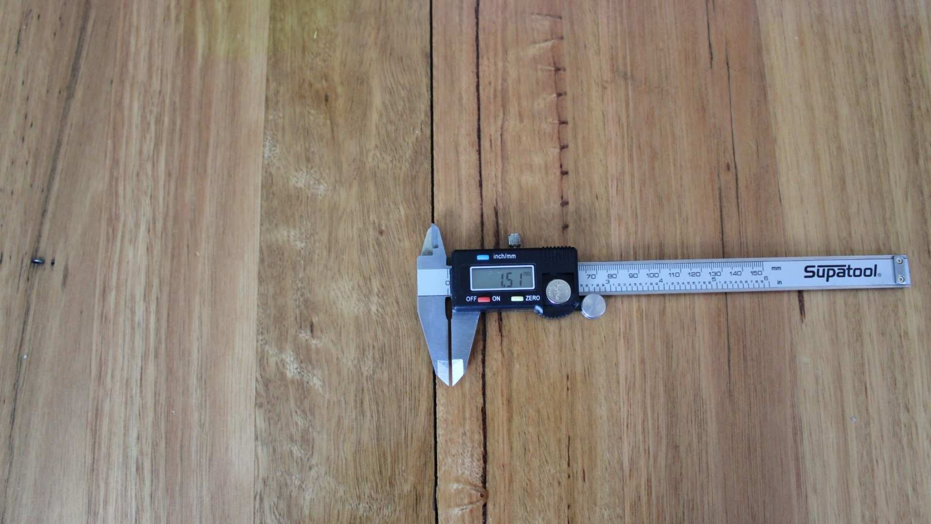 A tool used to measure the correct spacing between floor boards.