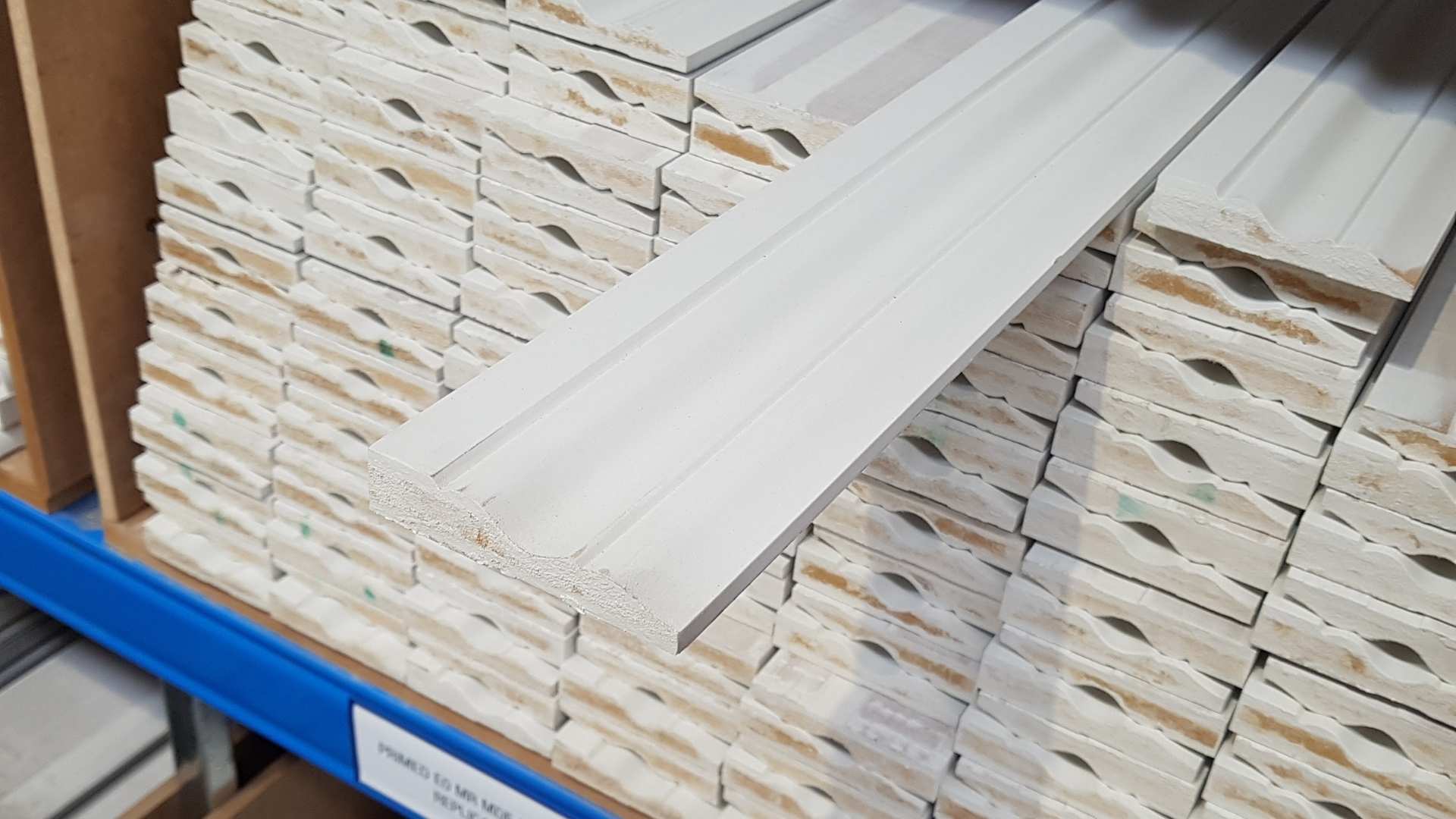 Skirting boards in pigeonhole of timber yard.