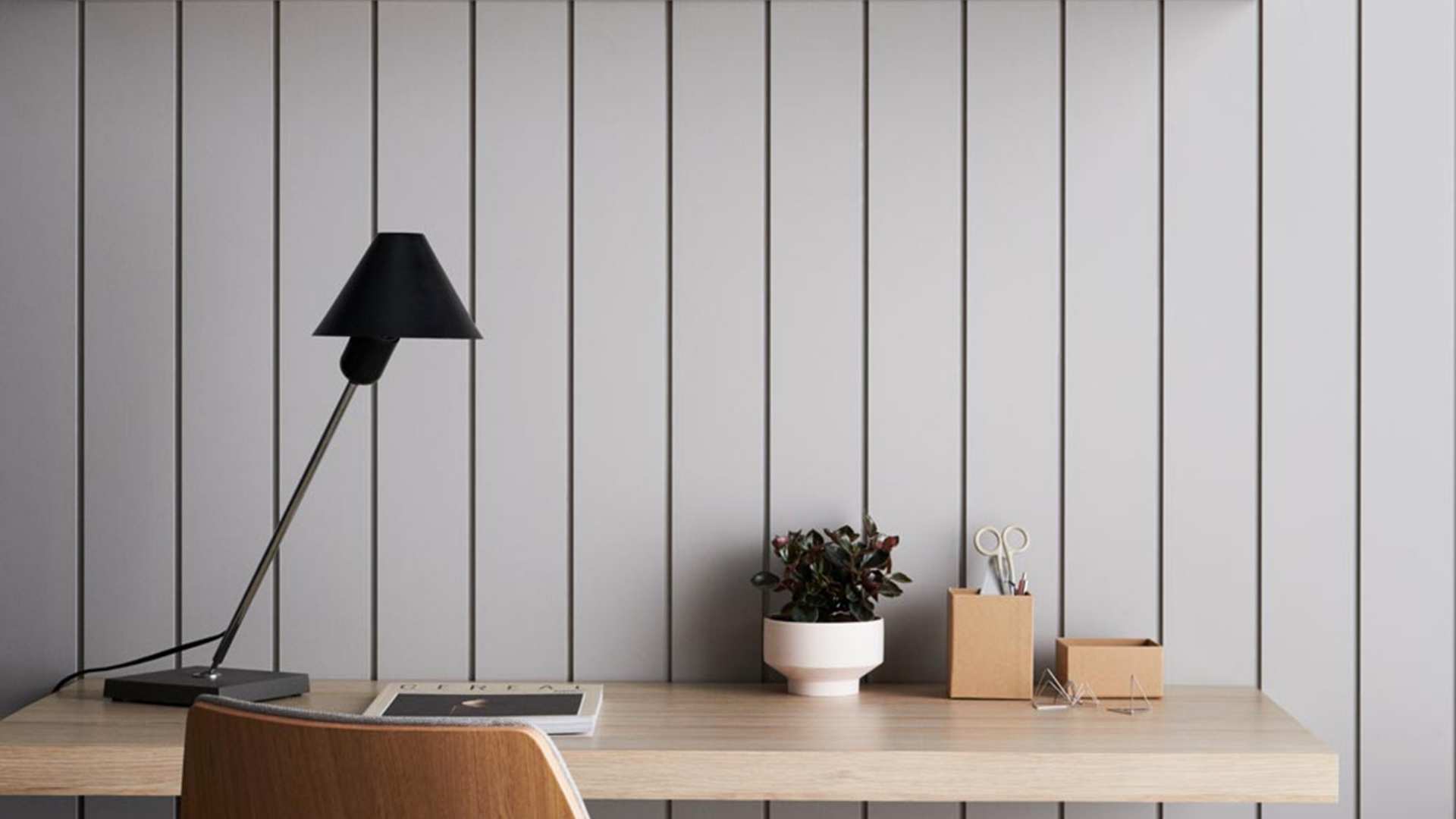 Composite internal lining boards used behind a desk.