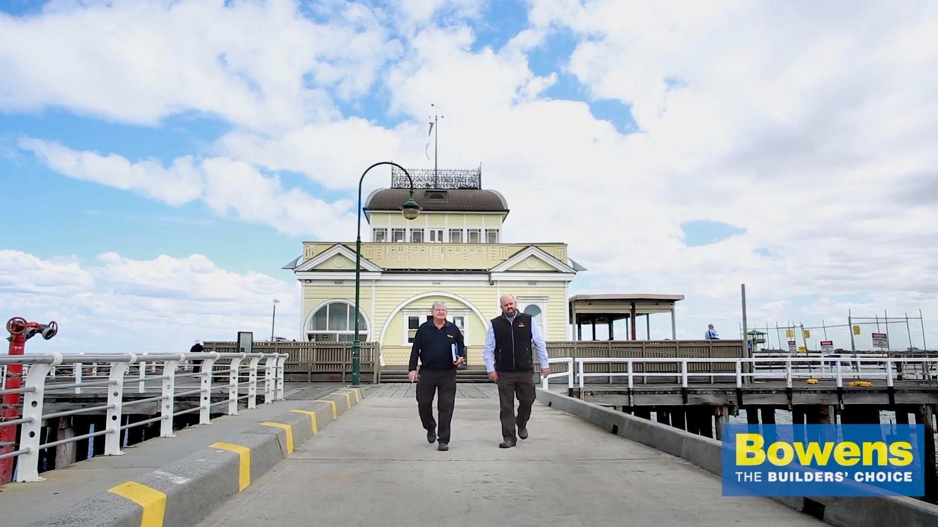 Timber Specialist Jeff Harvey and builder Howard McCorkell walk along St Kilda Pier in 2014.