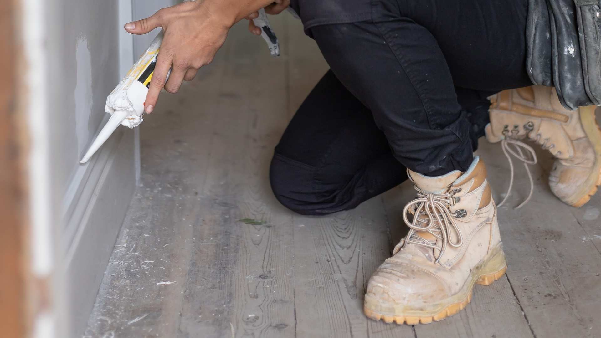 Close up of sealant/adhesive of timber skirting board.