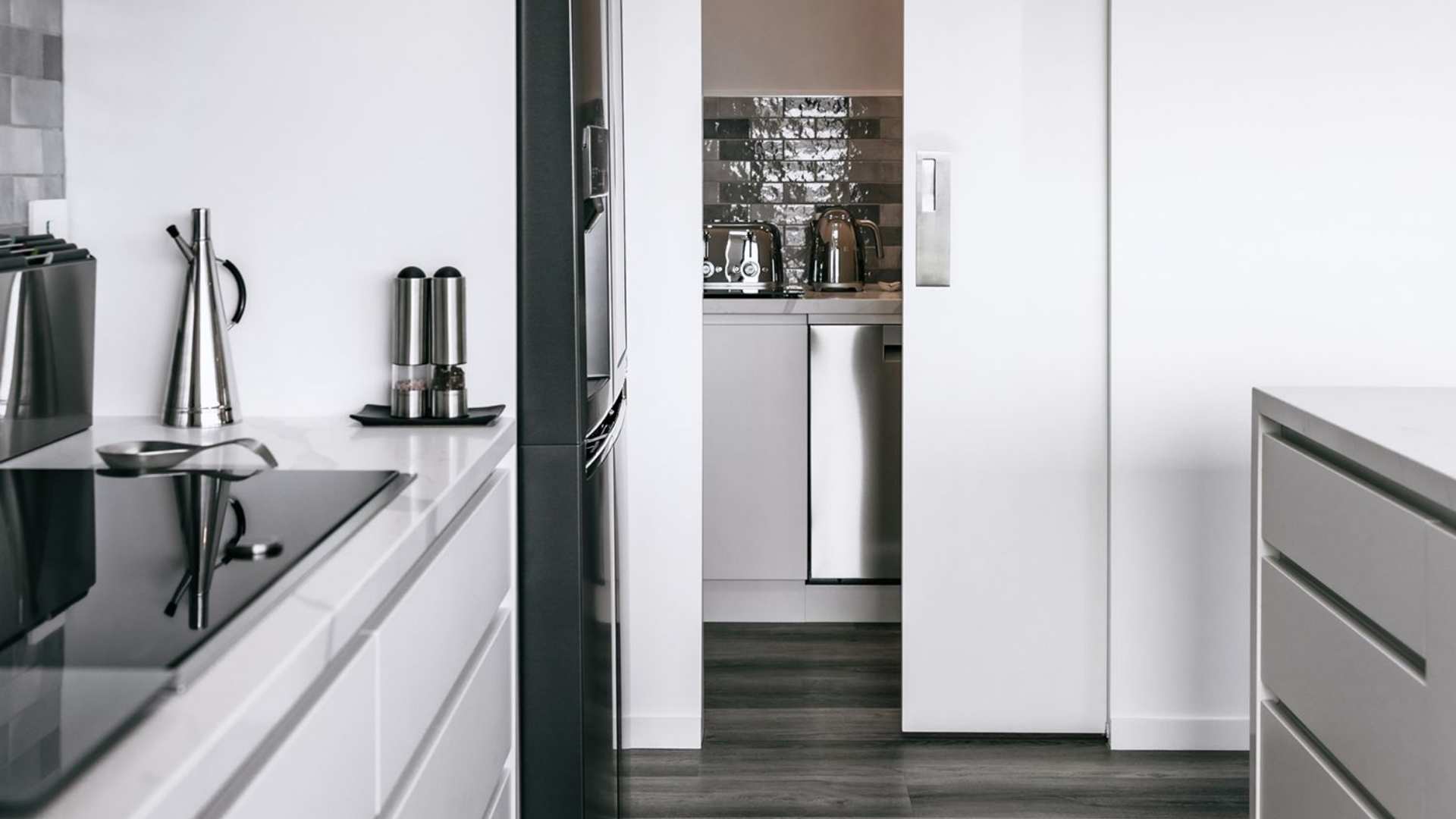 Zero clearance cavity sliding door used in kitchen pantry setting.