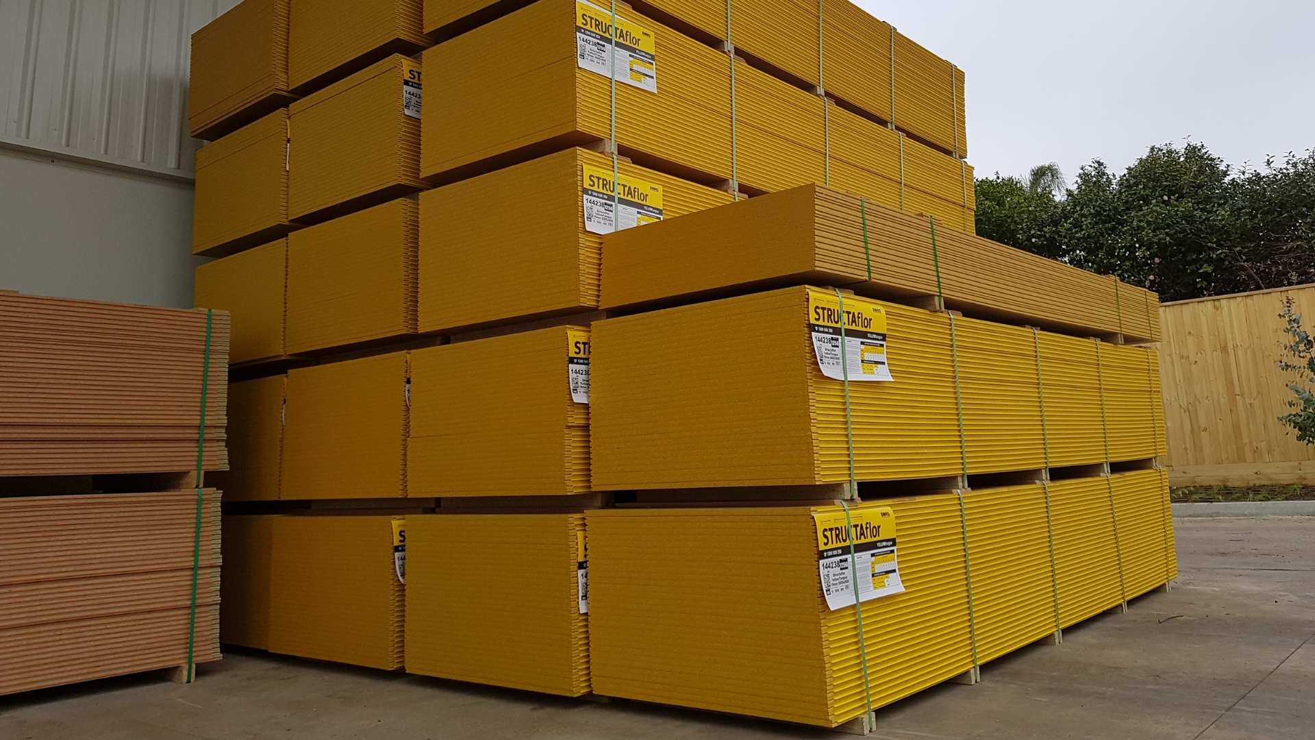 Yellowtongue flooring stacked on top each other ready for distribution.