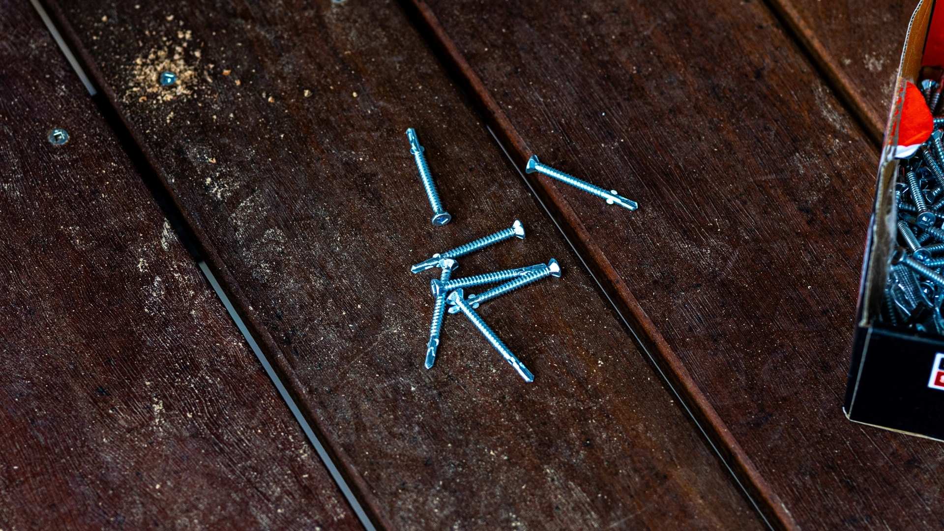 Close up shot of timber to steel decking screw, bi-metal with 316 stainless steel finish by Simpson Strong Tie.