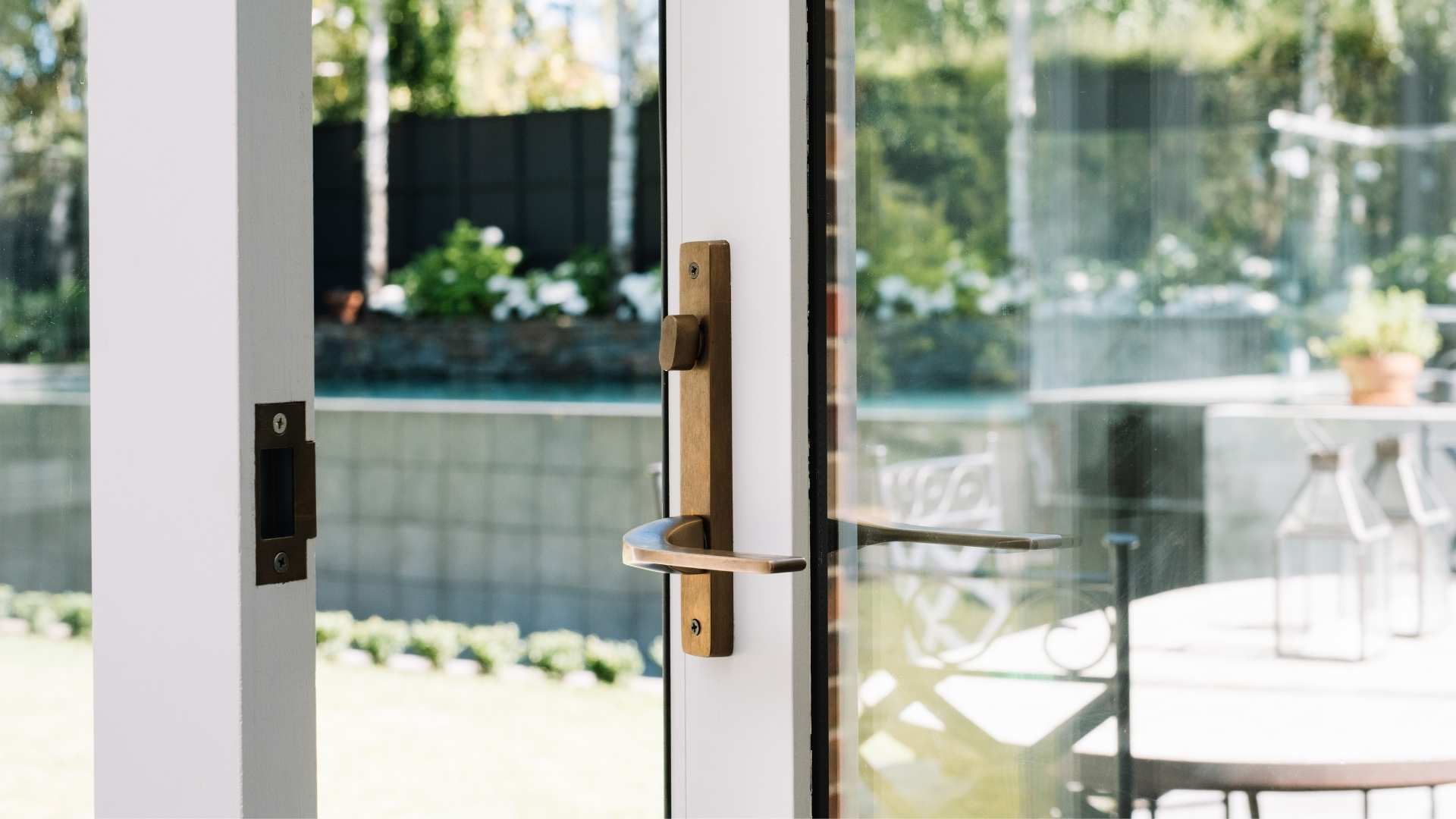 Glass exterior door showcasing frame and handle.