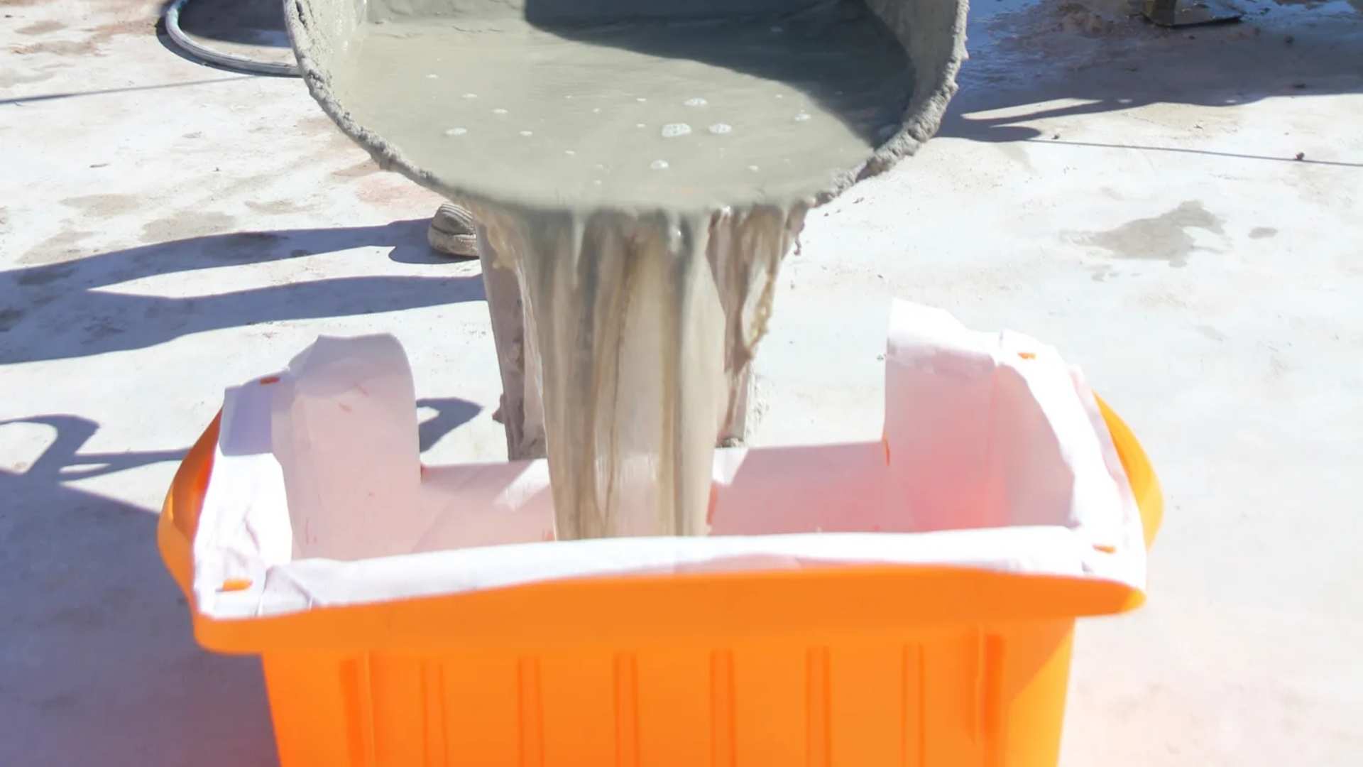 Liquid from barrel pouring into Slurry Tub.